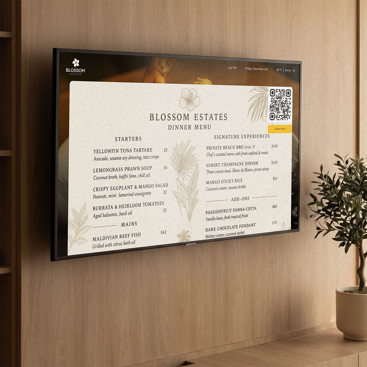 In-room TV showing dining offers with a QR code